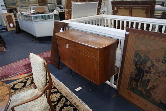 An Andrew John Milne for Heal and Sons rosewood twin pillar extending dining table, circa 1958, overall length 8ft x 3ft 9in. H.2ft 4in